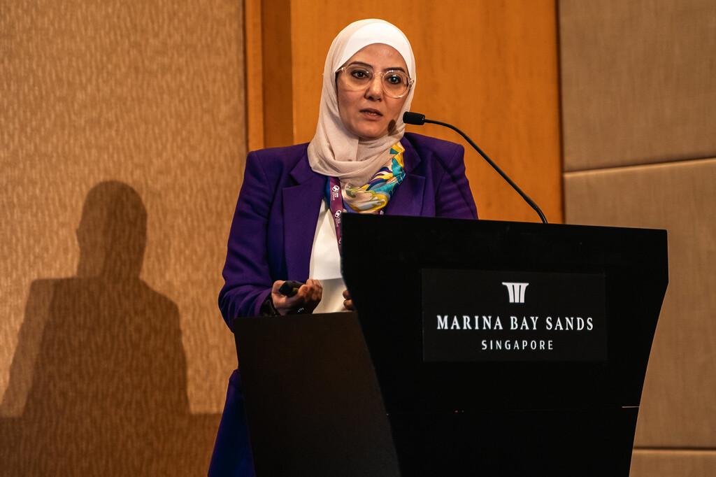 Speaker presenting at Marina Bay Sands during DDF Asia 2025.