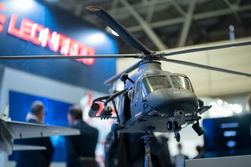 A detailed model of a helicopter showcased at DSEI Japan 2025.