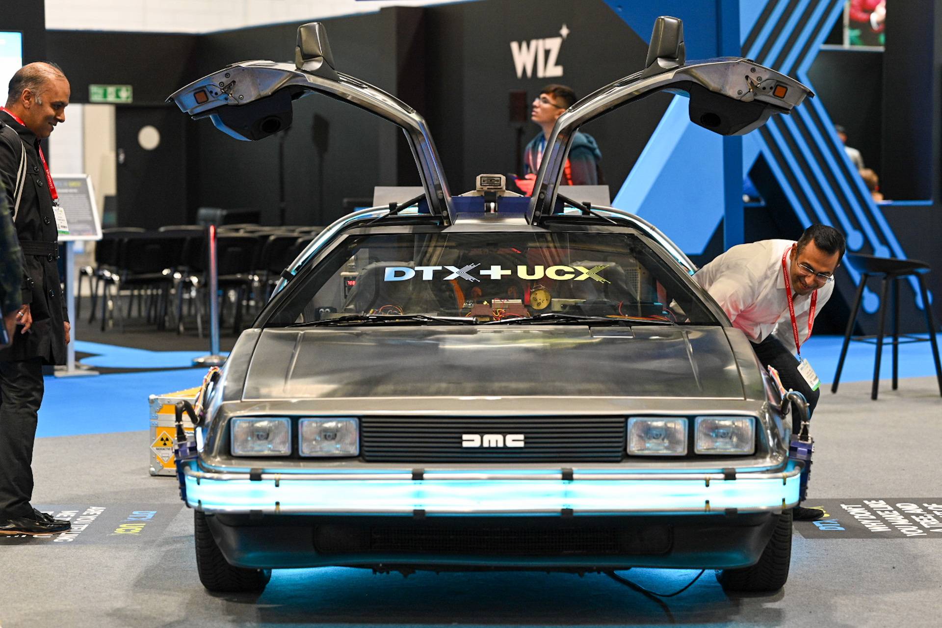 Car with open doors at event