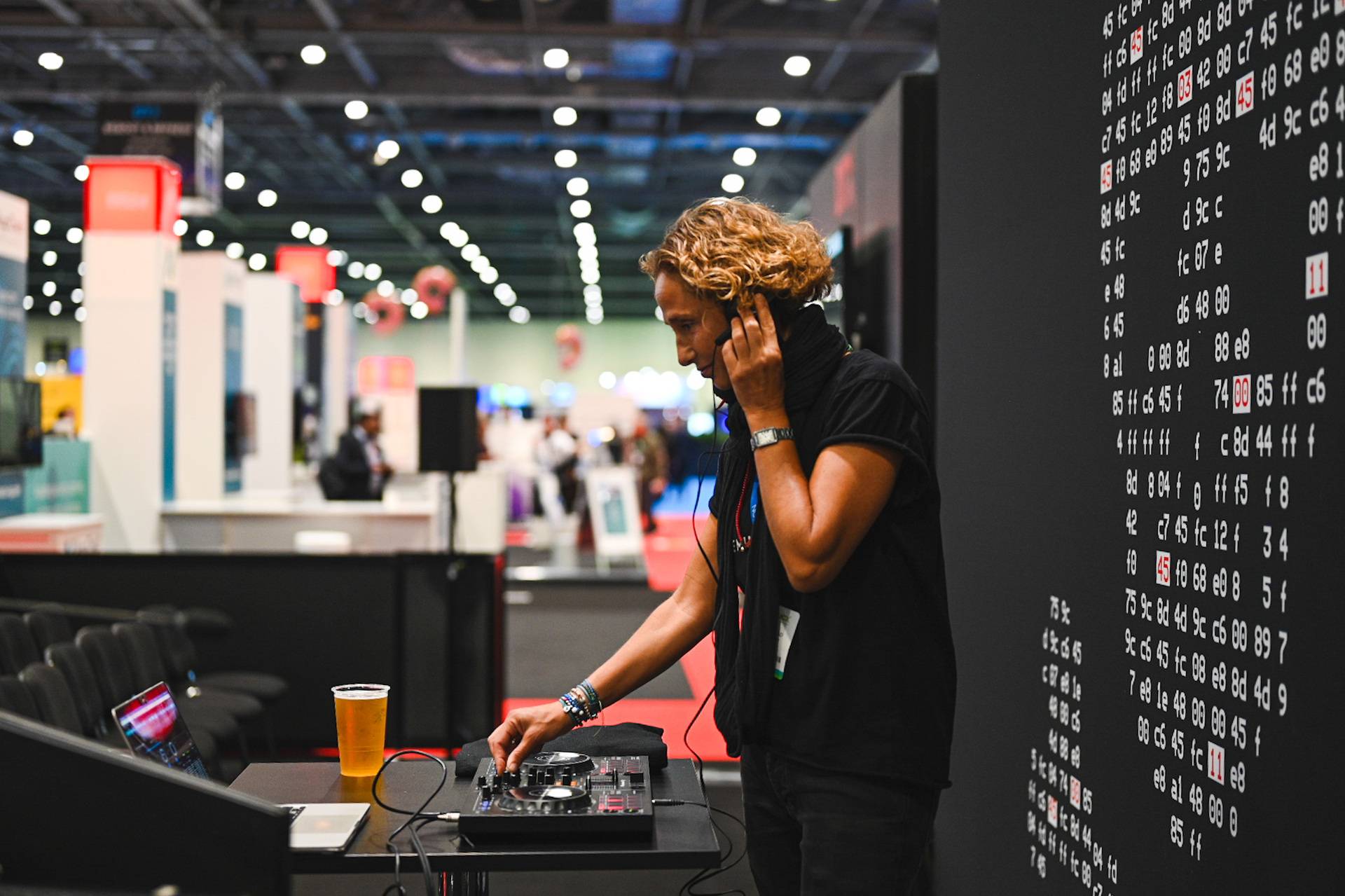 a person standing in front of a table with a device