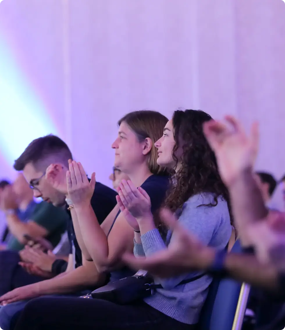 Audience applauding at InfoQ Dev Summit Munich 2025.