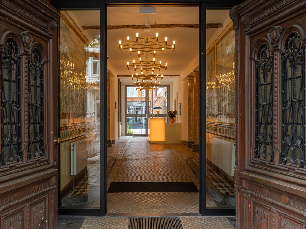 a glass door with a chandelier from it