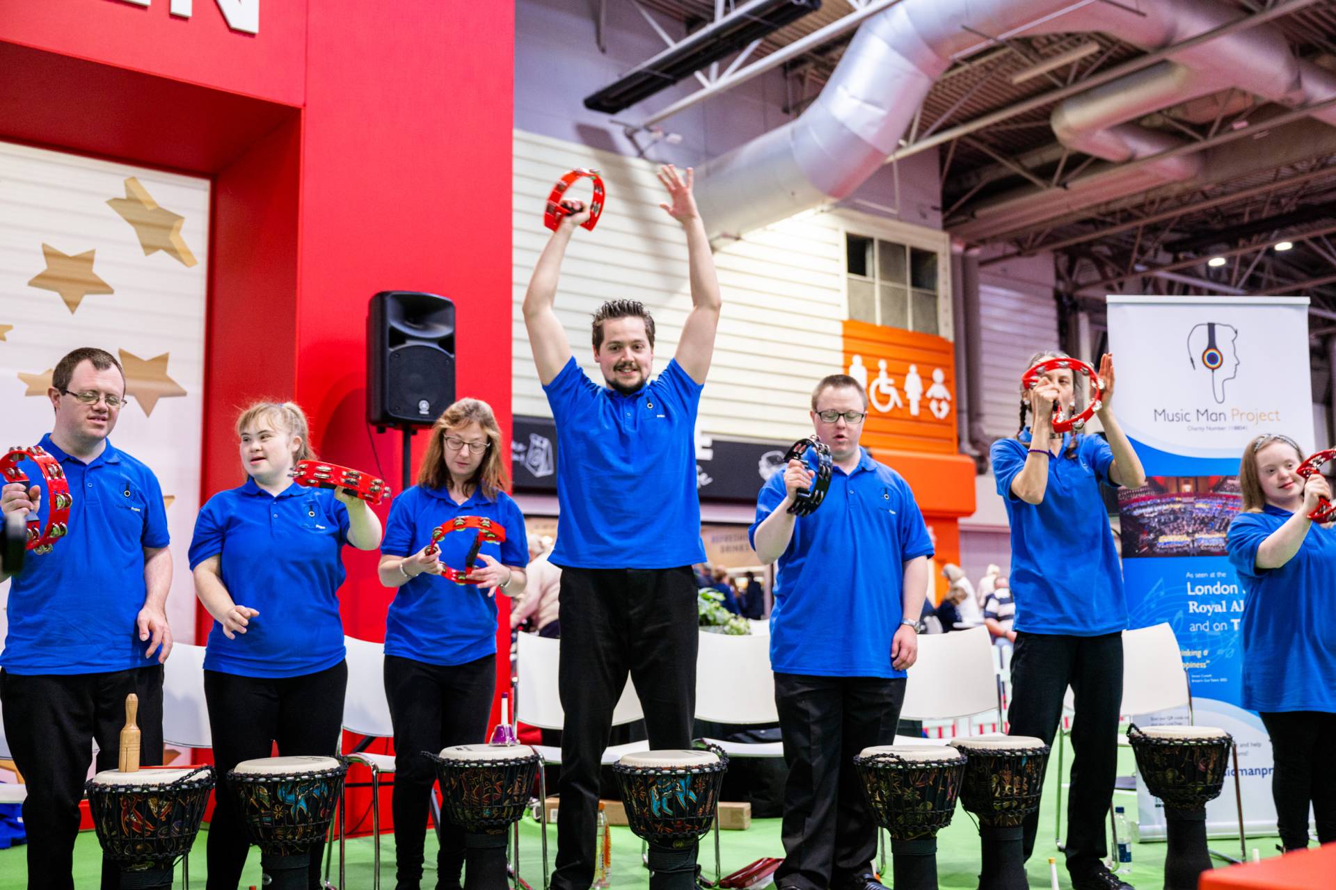 Energetic performance by a group at Naidex 2026, showcasing talent and inclusivity.