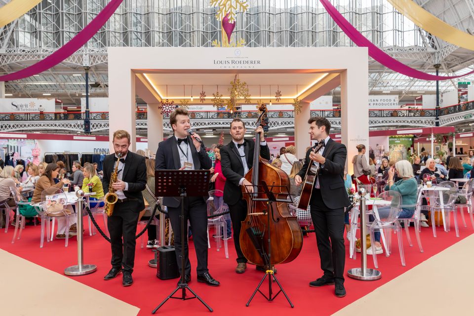 A group of musicians performing live festive music.