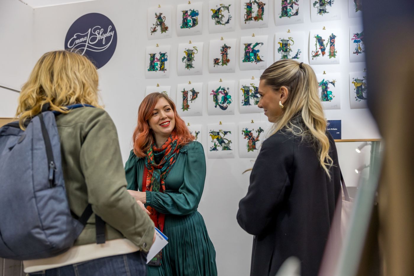 Engaging discussions at the art display section during the Spirit of Christmas Fair 2025.