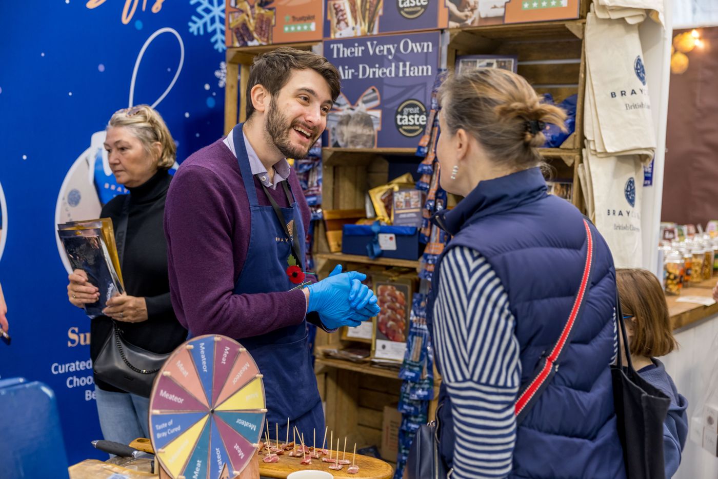 Engaging interactions at the Spirit of Christmas Fair 2025, featuring artisan treats and festive cheer.