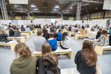 A captivated audience attends a session.