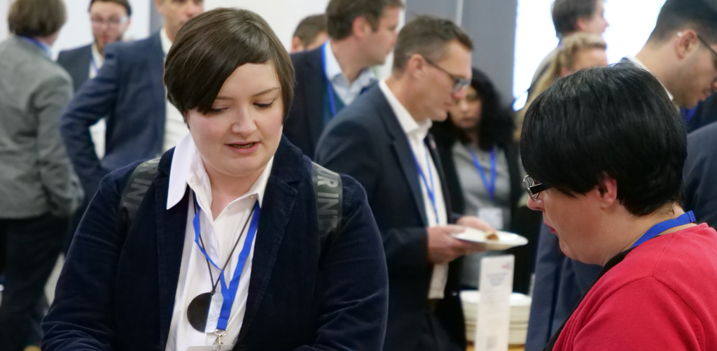 Attendees networking during the event