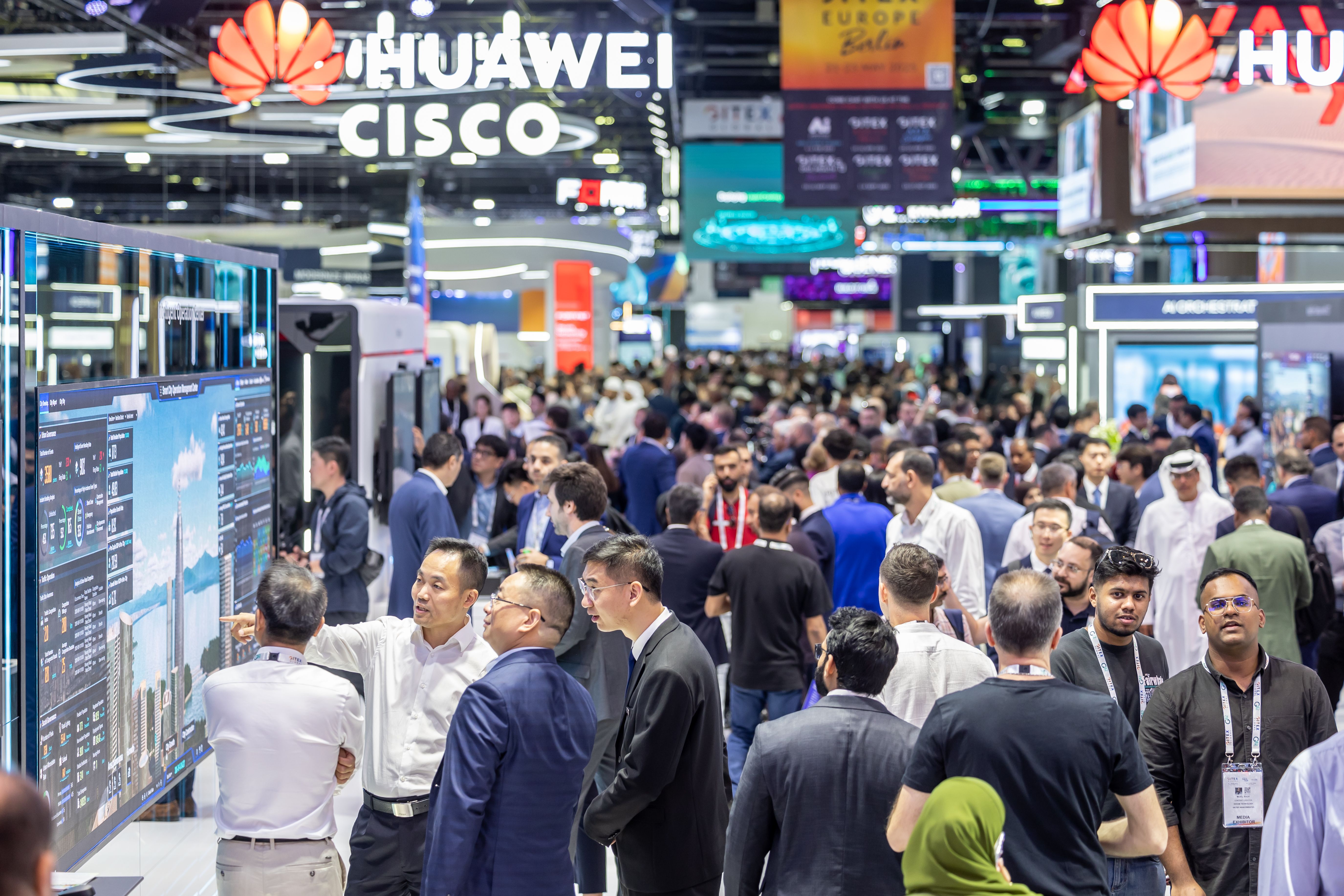 A bustling crowd at WAM Saudi 2026 explores innovative tech showcases.